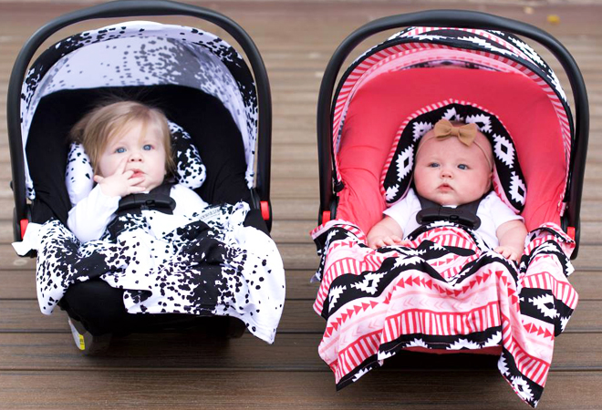Two Babies in Baby Canopies with Colorful Covers