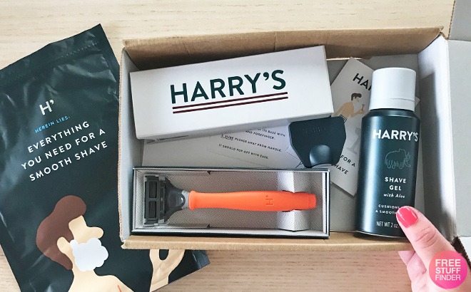 A Person Holding an Open Box with Harry's Razors Inside