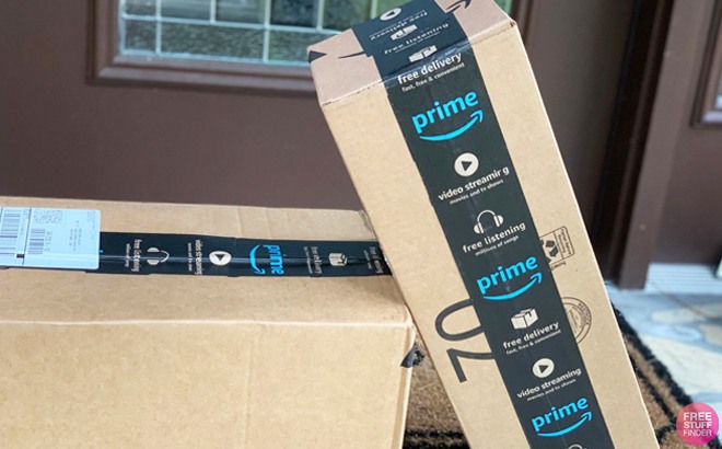 amazon boxes with prime tape in front of front door step