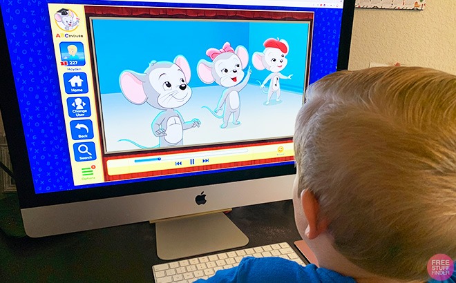 A Kid Watching Interactive Learning Program on a Screen