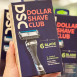 A Person Holding a Dollar Shave Club Razor Handle in a Box