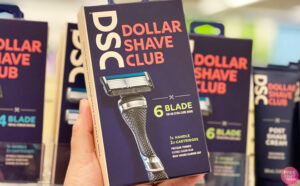 A Person Holding a Dollar Shave Club Razor Handle in a Box