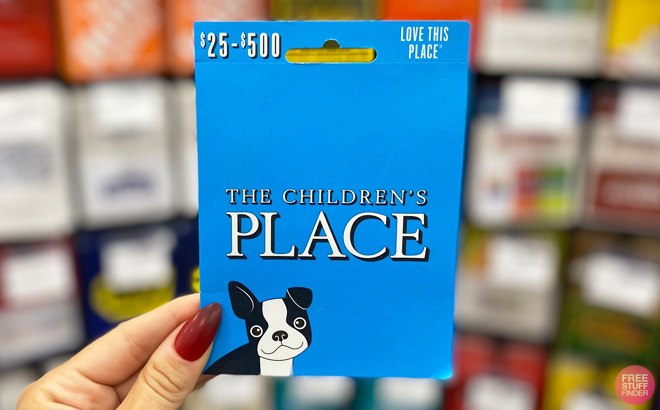 Woman Holding a Children's Place Gift Card in Store