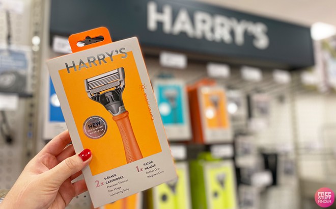 A Person Holding a Harry's Razors Box Inside a Store