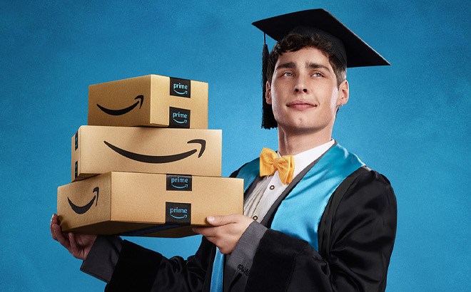 graduate student holding stacked amazon boxes