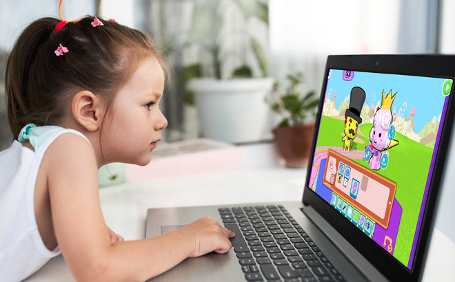 A Girl Playing a CodeSpark Game on a Laptop