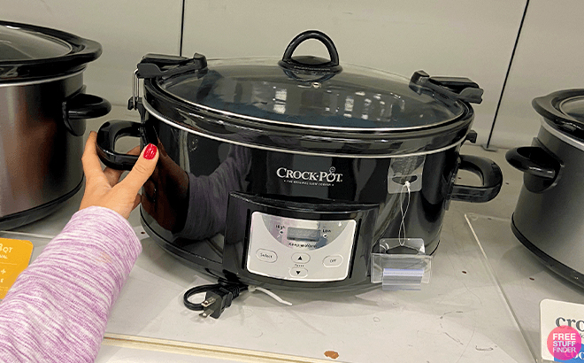 Hand Touching the Crockpot 7 Quart Slow Cooker