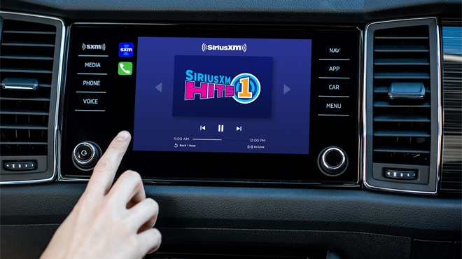 Hand Changing Channels on a SiriusXM Radio