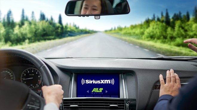 Woman Driving a Car with SiriusXM Radio Playing