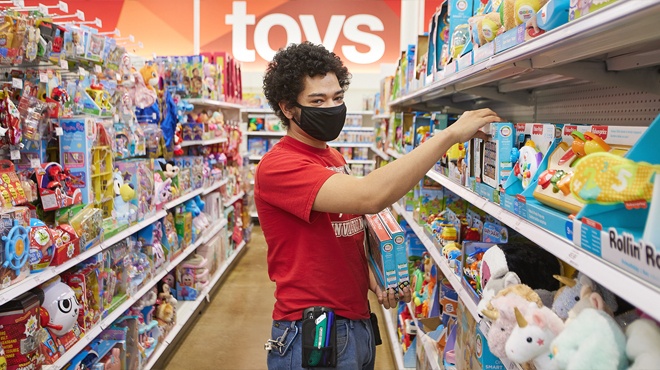 Target Employees Restocking Shelves in The Toy Aisle