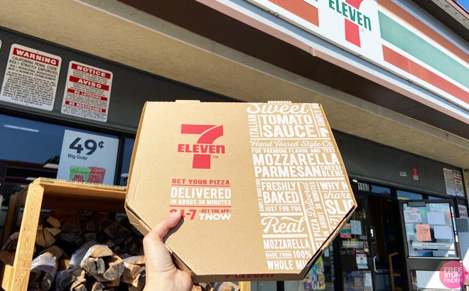 A Hand Holding a 7-Eleven Pizza Box