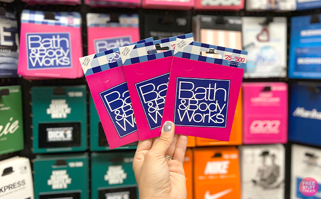 Hand Holding Bath Body Works Gift Cards