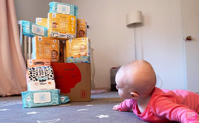 A Baby on the Floor Looking at Hello Bello Diaper Bundle