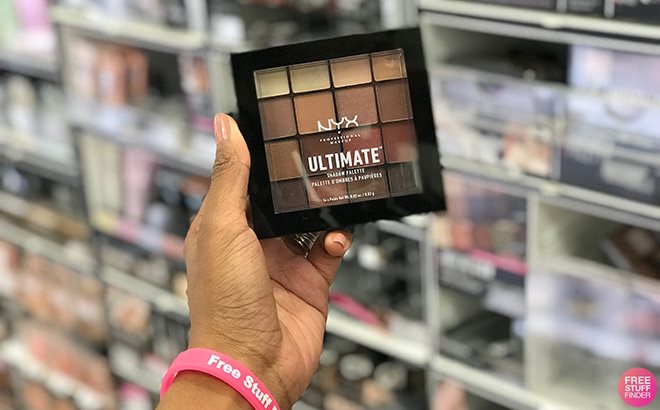 Hand Holding NYX Shadow Palette inside a Store