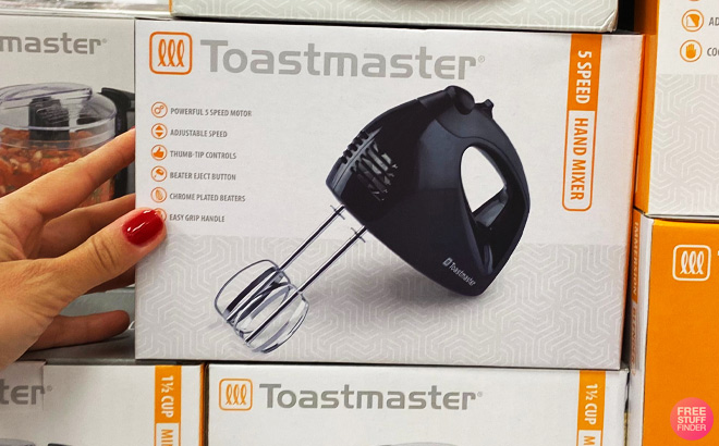 Hand Holding Toastmaster Hand Mixer