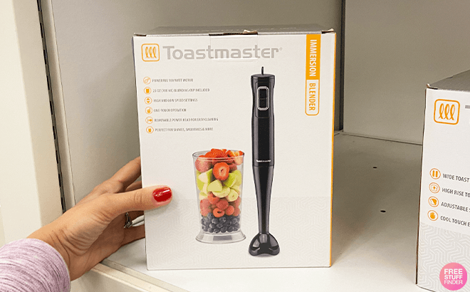 Hand Holding Toastmaster Immersion Blender on a Store Shelf