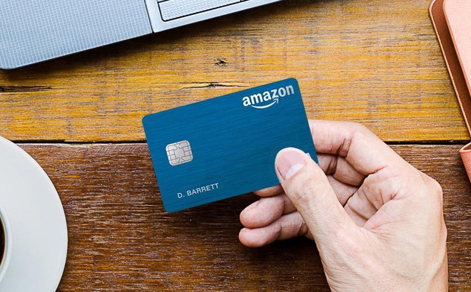 A Hand Holding an Amazon Card