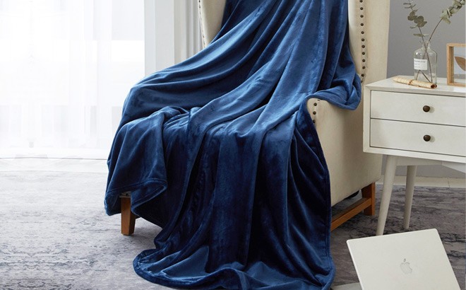 Serta So Huge Oversized Fleece Blanket Draped on a Chair