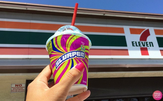 Hand Holding a 7-Eleven Slurpee in front of a Store