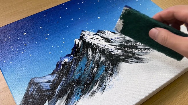 A Person Painting and Drawing a Mountain Landscape at Night at Artist’s Academy