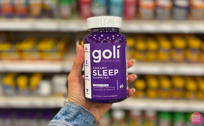 Person Holding Goli Dream Sleepy Gummy Vitamin 60 Count