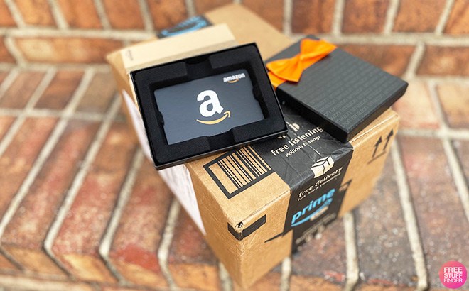 Amazon Gift Card on Top of an Amazon Box Amazon Gift Card on Top of an Amazon Box