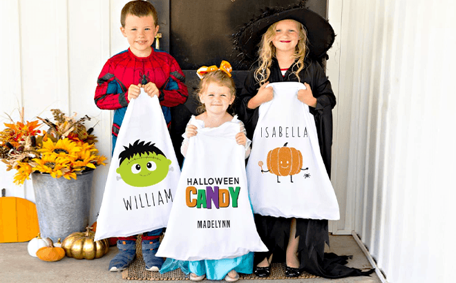 Kids Holding Personalized Halloween Trick-Or-Treat Bags