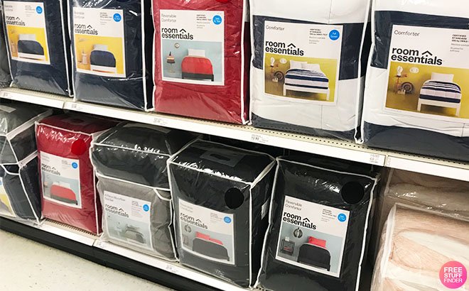 Room Essentials Reversible Microfiber Comforters on a Store Shelf