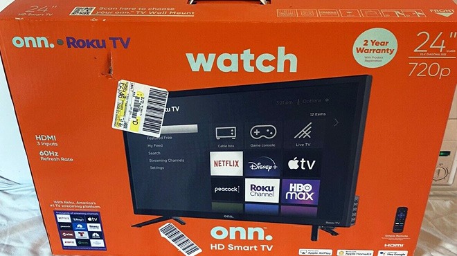 Onn. Roku 24-Inch TV in the Box on a White Sheet