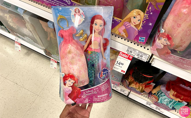 Hand Holding a Disney Princess Sea Styles Ariel Doll