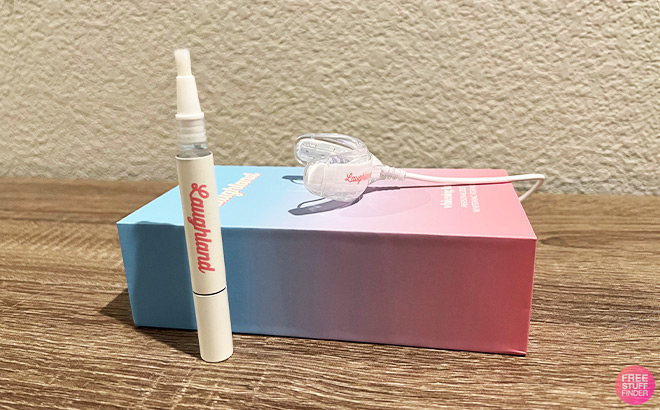 Laughland Gel Applicator and LED Mouthpiece on top of an Ombre Box on a Table Top