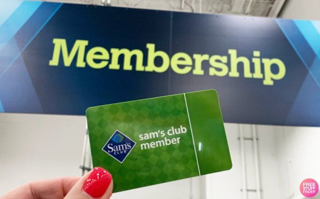 Hand Holding Sam's Club Membership Card in a Store