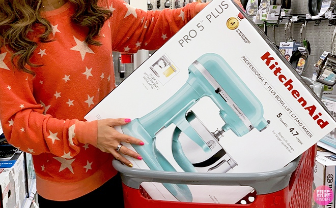 A Woman Holding a Kitchen Aid Mixer at a Target Store
