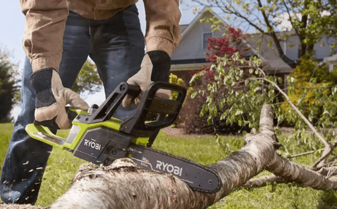 A Person Using the RYOBI ONE 18V 10 in Battery Chainsaw Tool Only