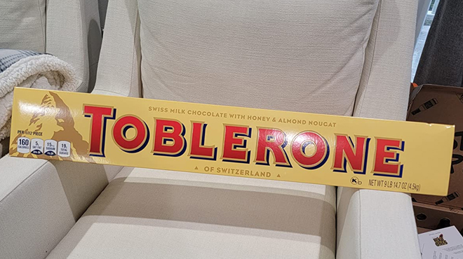 Giant 9lbs Toblerone Chocolate Bar on the Couch