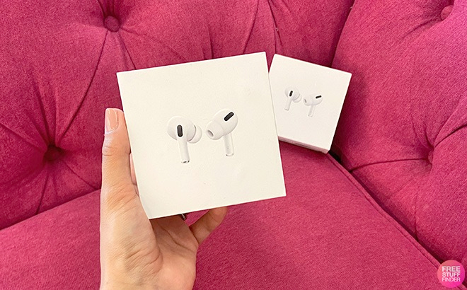 Hand Holding Apple AirPods Pro in a Box