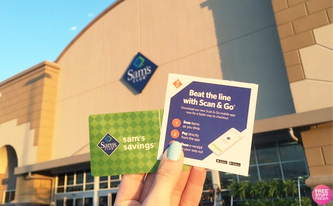 A Hand Holding a Sam's Club Card and a Scan And Go Leaflet