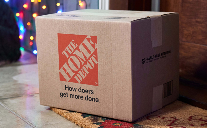 The Home Depot Cardboard Shipping Box Sitting on the Christmas Themed Decorated Front Porch