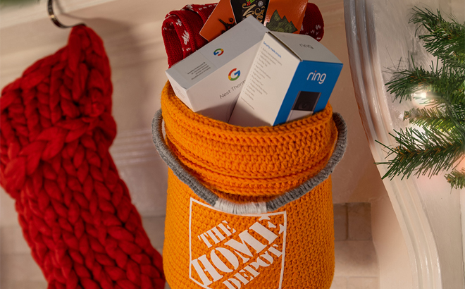 The Home Depot Orange Stocking Hung and Filled With Google Nest and Ring Doorbell Camera Products