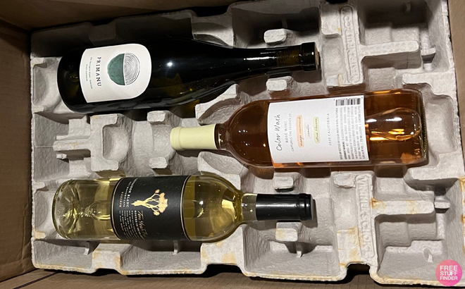 Three Bottles of Wine Laid Down in a Cardboard Box