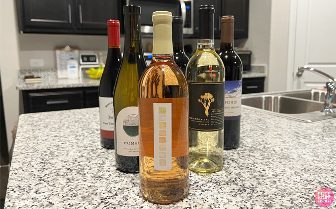 Six Different Bottles of White and Red Wine on a Kitchen Counter