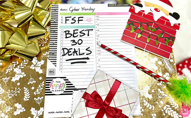 A Page from a Calendar on a Table with a Cyber Monday Date Note Surrounded by Christmas Decor