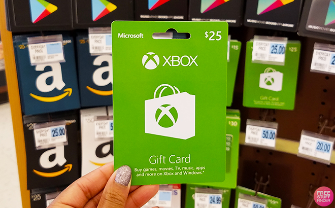 Woman Holding an Xbox Gift Card in Store
