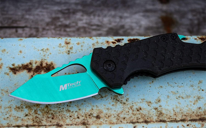 A Stainless Steel Folding Knife in Green Color