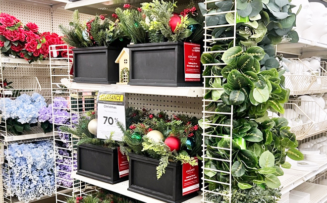 Christmas artificial plant with balls on the shelf