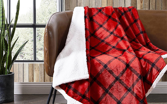 Eddie Bauer Reversible Sherpa Fleece Throw Blanket on a Couch
