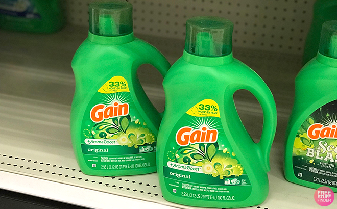 Two Gain Liquid Laundry Detergents Original Scent Plus Aroma Boost on a Store Shelf