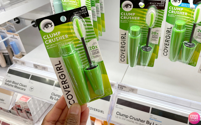 A Hand Holding Covergirl Clump Crusher Mascara A Hand Holding Covergirl Clump Crusher Mascara