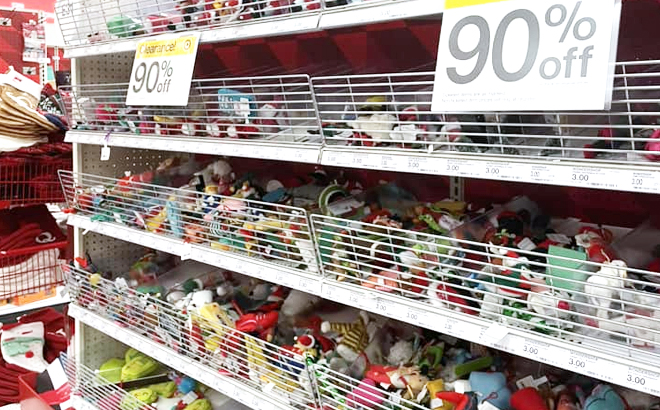 Assorted Ornaments on the shelf with 90 off clearance tag