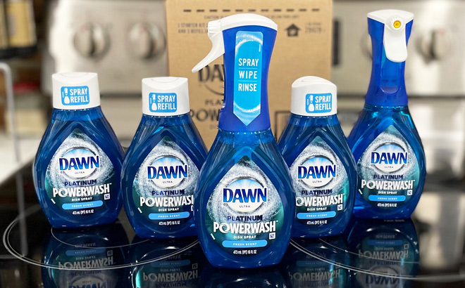 2 Dawn Platinum Powerwash Dish Sprays and 3 Refill Bottles Bundle on a Kitchen Stove in Front of an Amazon Box